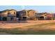 Exterior view of a well-kept property featuring a balcony, offering a glimpse of comfortable and stylish suburban living at 14257 W Harvard St, Goodyear, AZ 85395