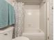 Cozy bathroom featuring a tub with tiled walls and modern fixtures at 1506 E Gemini Dr, Tempe, AZ 85283