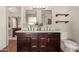 Elegant bathroom with a double sink vanity, modern fixtures, and plenty of storage space at 1506 E Gemini Dr, Tempe, AZ 85283