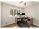 Bright bedroom featuring a treadmill and a large window for a workout with natural light at 1506 E Gemini Dr, Tempe, AZ 85283