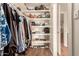 Organized walk-in closet with shelving and hanging space for clothes, shoes, and accessories at 1506 E Gemini Dr, Tempe, AZ 85283