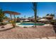 A beautiful backyard oasis with a sparkling pool and desert landscaping at 1506 E Gemini Dr, Tempe, AZ 85283