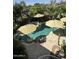 Overhead shot showcases a stunning pool with a spa surrounded by lush landscaping at 15266 N 146Th Ln, Surprise, AZ 85379