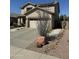 Charming two-story home featuring a desert-landscaped front yard and a two-car garage at 15266 N 146Th Ln, Surprise, AZ 85379