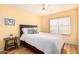 Comfortable bedroom featuring a ceiling fan, a side table, and a window at 15618 N 12Th Ave, Phoenix, AZ 85023