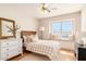 Charming bedroom with a window seat, a cozy bed, and neutral decor offers a warm and inviting atmosphere at 15618 N 12Th Ave, Phoenix, AZ 85023