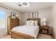 Inviting bedroom with a wooden bed frame, neutral decor, and ample natural light offers a comfortable and relaxing retreat at 15618 N 12Th Ave, Phoenix, AZ 85023