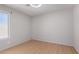 Cozy bedroom with hardwood floors, a ceiling fan, and a bright window offers a simple and comfortable space at 15618 N 12Th Ave, Phoenix, AZ 85023