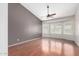 Bright bedroom with a ceiling fan, natural light, and hardwood floors offer a welcoming and comfortable space at 15618 N 12Th Ave, Phoenix, AZ 85023