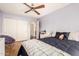 This bedroom offers a ceiling fan, a large closet and neutral walls at 15618 N 12Th Ave, Phoenix, AZ 85023