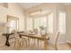 Cozy dining area with plantation shutters, a modern chandelier and nice table with chairs, perfect for entertaining at 15618 N 12Th Ave, Phoenix, AZ 85023
