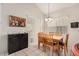 Cozy dining room with a wooden table set and modern lighting fixture at 15618 N 12Th Ave, Phoenix, AZ 85023