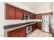 Well-equipped kitchen with stainless steel appliances, plentiful cabinetry, and smooth countertops at 15618 N 12Th Ave, Phoenix, AZ 85023