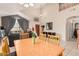 Open floor plan showcasing the living room and dining room, featuring high ceilings and neutral walls at 15618 N 12Th Ave, Phoenix, AZ 85023