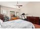 Spacious main bedroom features vaulted ceilings, a ceiling fan, a treadmill, a dresser and a work area with great light at 15618 N 12Th Ave, Phoenix, AZ 85023