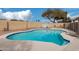Backyard swimming pool featuring a concrete deck, surrounding block fence, and lounge chairs at 15618 N 12Th Ave, Phoenix, AZ 85023