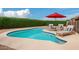 Beautiful backyard pool with lounge chairs and shade offers a perfect spot for relaxation and outdoor enjoyment at 15618 N 12Th Ave, Phoenix, AZ 85023