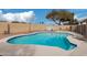 A private in-ground pool, surrounded by neutral patio, enclosed with a block fence and desert landscaping at 15618 N 12Th Ave, Phoenix, AZ 85023