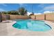 A private backyard oasis featuring a sparkling pool surrounded by desert landscape, perfect for relaxation at 15618 N 12Th Ave, Phoenix, AZ 85023