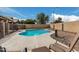 Inviting backyard pool area with stylish patio furniture and a well-maintained desert landscape at 15618 N 12Th Ave, Phoenix, AZ 85023