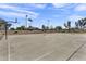 Outdoor basketball court in a community park with trees and blue skies in the background at 1600 N Saba St # 224, Chandler, AZ 85225