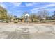 Basketball court in a community park with playground in the background on a sunny day at 1600 N Saba St # 224, Chandler, AZ 85225