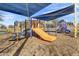 Outdoor playground with yellow slide, climbing structures and blue shade canopies at 1600 N Saba St # 224, Chandler, AZ 85225