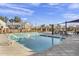 Community pool with lounge chairs and well-maintained pool deck at 1600 N Saba St # 224, Chandler, AZ 85225