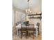 Bright dining area with plantation shutters, chandelier, and wood dining set at 16207 W Moreland St, Goodyear, AZ 85338