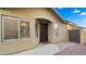 Welcoming front entrance with decorative door, shutters, and beautiful landscaping at 16207 W Moreland St, Goodyear, AZ 85338