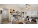 Bright living room with tile floors, plantation shutters, and a comfortable gray sofa at 16207 W Moreland St, Goodyear, AZ 85338