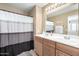 Bathroom with a dual sink vanity, neutral walls, and a shower-tub combo at 17445 N 185Th Dr, Surprise, AZ 85374