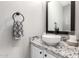 Modern powder room featuring a vessel sink on a granite countertop and sleek black hardware at 17445 N 185Th Dr, Surprise, AZ 85374