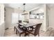 Charming dining area featuring a farmhouse-style table, bench seating, and abundant natural light at 17445 N 185Th Dr, Surprise, AZ 85374