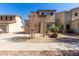 Charming two-story home with stone accents, a landscaped front yard, and a covered entry at 17445 N 185Th Dr, Surprise, AZ 85374