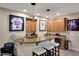 Wet bar with granite countertops, custom cabinets, and a wine refrigerator for beverage storage at 18059 W Ocotillo Ave, Goodyear, AZ 85338