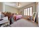 Bedroom with a full-length mirror, carpeted floors and natural light at 18059 W Ocotillo Ave, Goodyear, AZ 85338