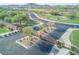 Scenic view of the landscaped community entrance, with the golf course and street at 18059 W Ocotillo Ave, Goodyear, AZ 85338