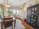 Dining room with wood table, chairs, lots of light, and an antique china cabinet at 18059 W Ocotillo Ave, Goodyear, AZ 85338