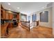 Hallway with built-in desk area, wood cabinets and view of the staircase at 18059 W Ocotillo Ave, Goodyear, AZ 85338