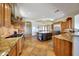 Spacious kitchen features stone countertops, stainless steel appliances and center island at 18059 W Ocotillo Ave, Goodyear, AZ 85338