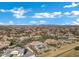 Aerial shot of a home with a pool surrounded by lush greenery in a well-maintained community, perfect for families at 20125 E Melissa Pl, Queen Creek, AZ 85142