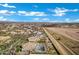 Aerial view of a home with a private pool in a residential neighborhood, showcasing community and landscaping at 20125 E Melissa Pl, Queen Creek, AZ 85142