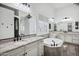 Bathroom features dual vanities, soaking tub, granite countertop and decorative mirrors at 20125 E Melissa Pl, Queen Creek, AZ 85142