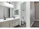 Bathroom with double sink vanity with sleek black hardware and a window at 20125 E Melissa Pl, Queen Creek, AZ 85142