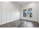 Minimal bedroom with floor to ceiling molding and wooden floors at 20125 E Melissa Pl, Queen Creek, AZ 85142