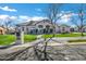 Stunning single-story home showcasing lush landscaping, brick accents, and a charming paver driveway at 20125 E Melissa Pl, Queen Creek, AZ 85142