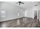 Bright living room with recessed lights, shutters and wood-look flooring at 20125 E Melissa Pl, Queen Creek, AZ 85142