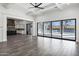 Open living space with hardwood floors, coffered ceilings, and view of the backyard at 20125 E Melissa Pl, Queen Creek, AZ 85142