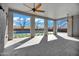 Stylish covered patio with brick columns and ceiling fans overlooking a pool, ideal for outdoor lounging at 20125 E Melissa Pl, Queen Creek, AZ 85142